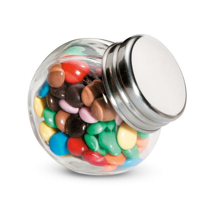 Chocolate lentils in a glass dispenser
