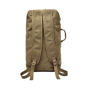 Sac à dos brun avec bretelles brunes et poche latérale, vu de derrière